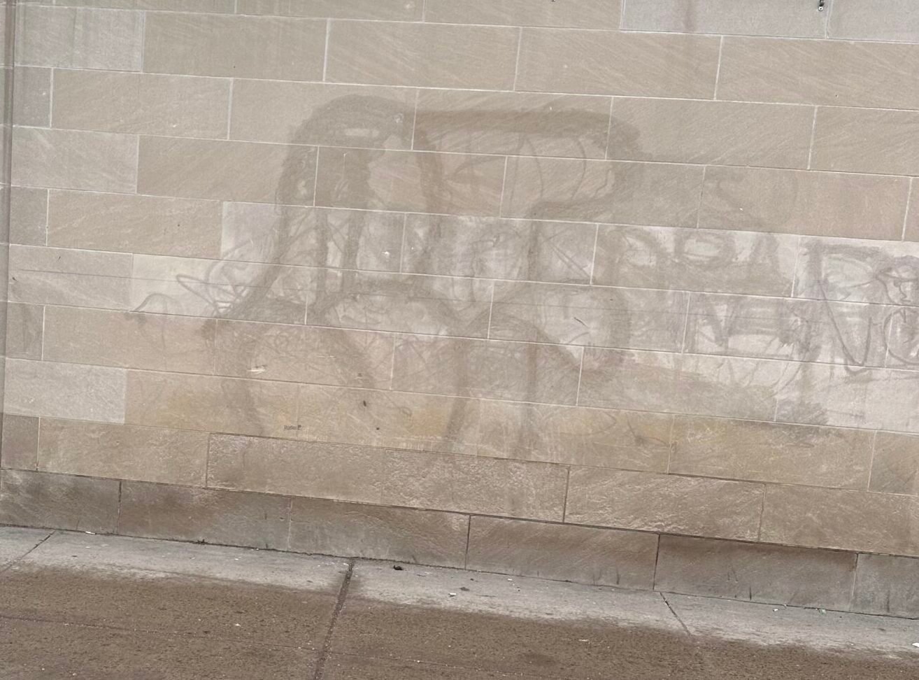 Image of etching left behind from improper graffiti removal techniques